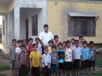Orphanage Director Dipak Adhikari with the Children